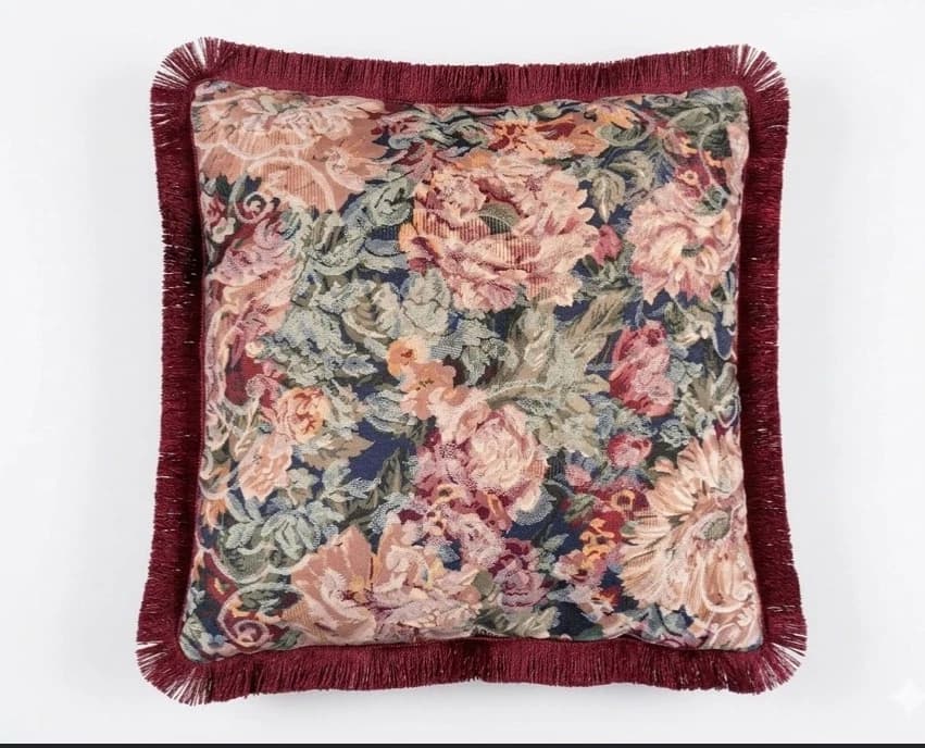 Burgundy and grey velvet tapestry throw with pink roses, green leaves, and fringe edges.